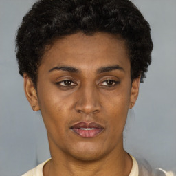 Joyful latino young-adult female with short  black hair and brown eyes