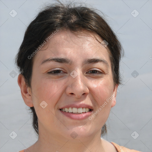 Joyful white adult female with medium  brown hair and brown eyes