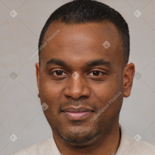 Joyful black young-adult male with short  black hair and brown eyes
