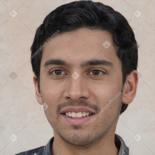 Joyful white young-adult male with short  black hair and brown eyes