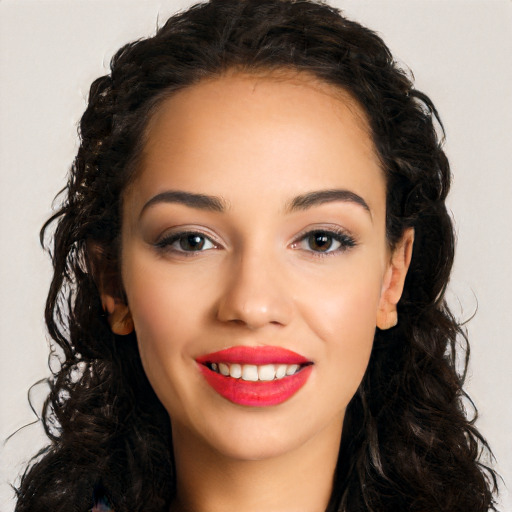 Joyful white young-adult female with long  black hair and brown eyes