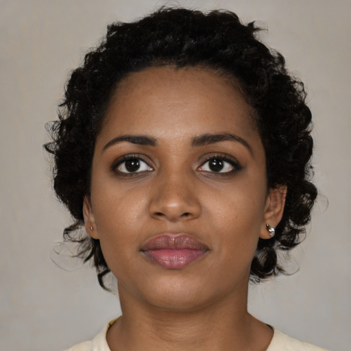 Neutral black young-adult female with medium  brown hair and brown eyes