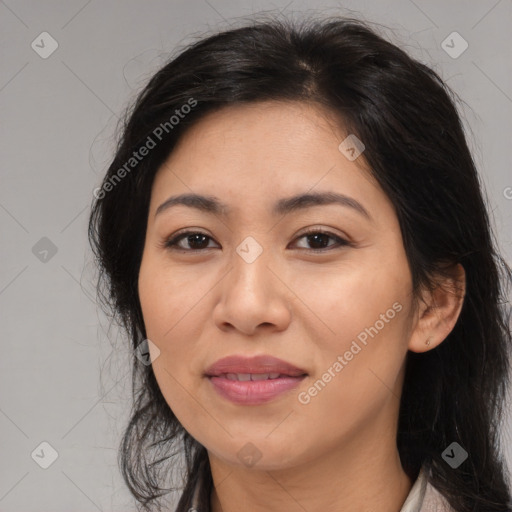 Joyful latino young-adult female with long  brown hair and brown eyes