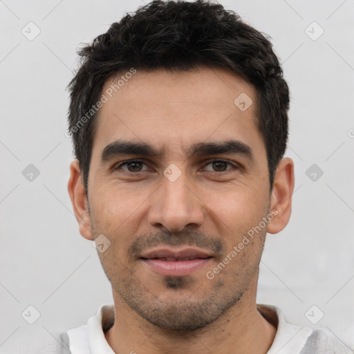 Joyful white young-adult male with short  black hair and brown eyes