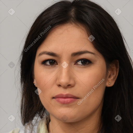 Joyful asian young-adult female with long  brown hair and brown eyes