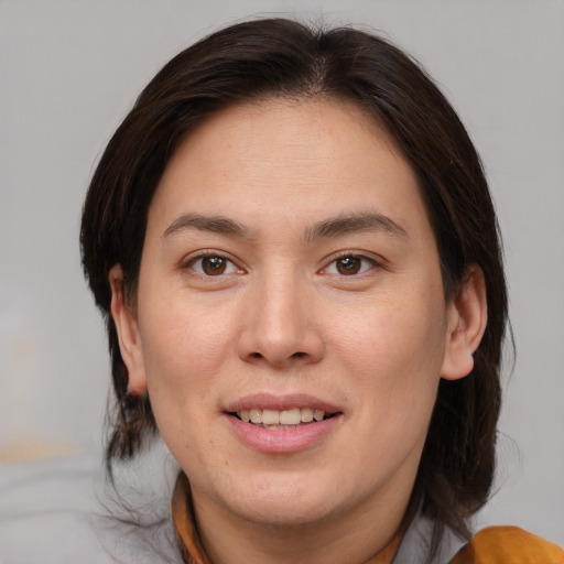 Joyful white young-adult female with medium  brown hair and brown eyes