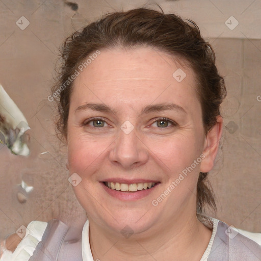 Joyful white adult female with medium  brown hair and blue eyes