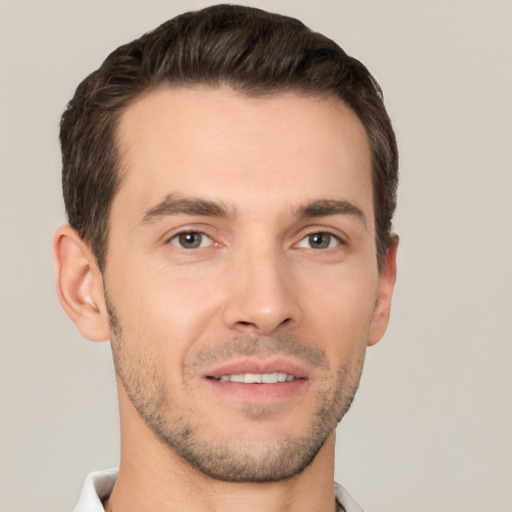 Joyful white young-adult male with short  brown hair and brown eyes