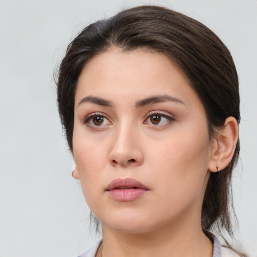 Neutral white young-adult female with medium  brown hair and brown eyes