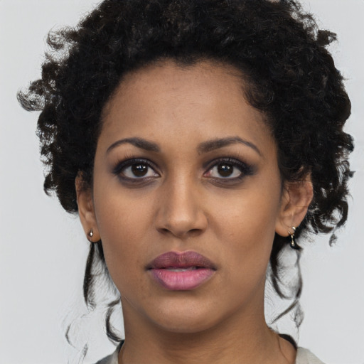 Neutral black young-adult female with medium  black hair and brown eyes