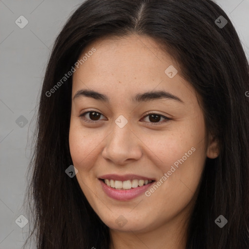 Joyful asian young-adult female with long  brown hair and brown eyes