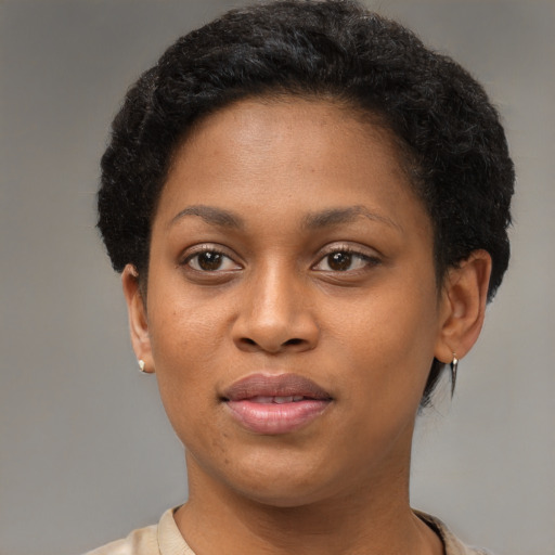 Joyful black young-adult female with short  brown hair and brown eyes