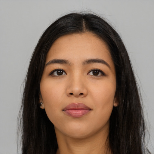 Neutral latino young-adult female with long  black hair and brown eyes