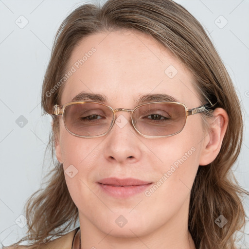 Joyful white young-adult female with long  brown hair and blue eyes