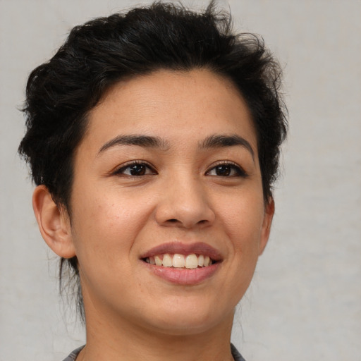 Joyful asian young-adult female with short  brown hair and brown eyes
