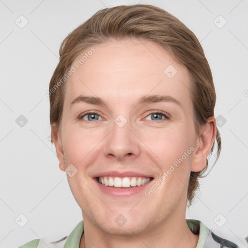 Joyful white young-adult female with medium  brown hair and grey eyes