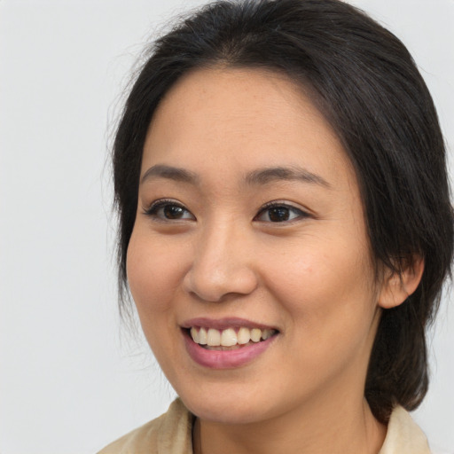 Joyful white young-adult female with medium  brown hair and brown eyes