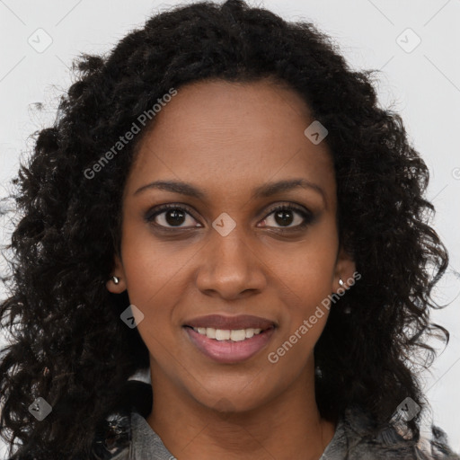 Joyful black young-adult female with long  brown hair and brown eyes