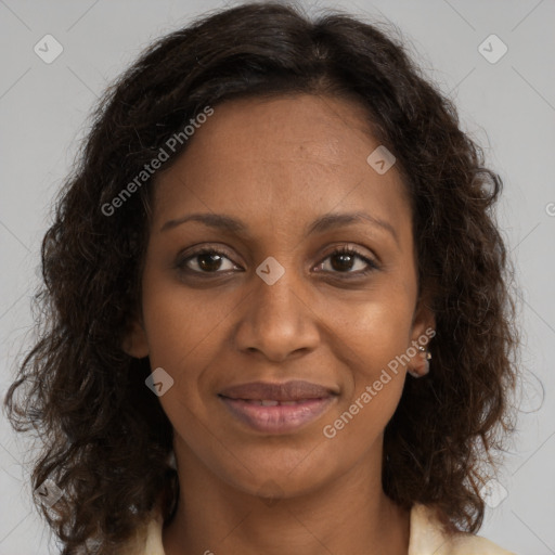 Joyful black adult female with medium  brown hair and brown eyes