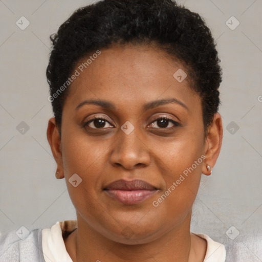 Joyful black young-adult female with short  brown hair and brown eyes