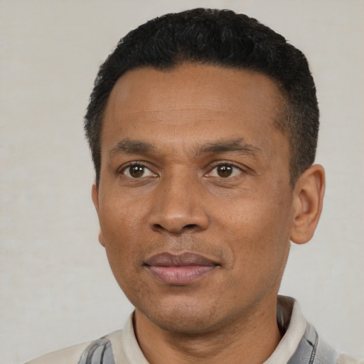 Neutral latino adult male with short  black hair and brown eyes