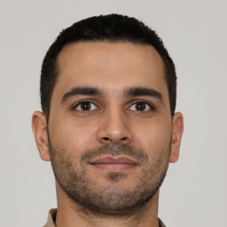 Neutral latino young-adult male with short  brown hair and brown eyes