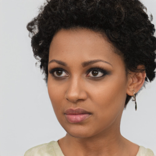 Neutral black young-adult female with short  brown hair and brown eyes