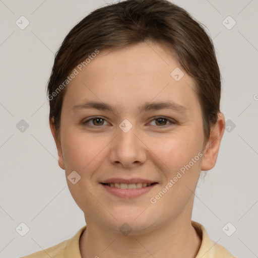 Joyful white young-adult female with short  brown hair and brown eyes