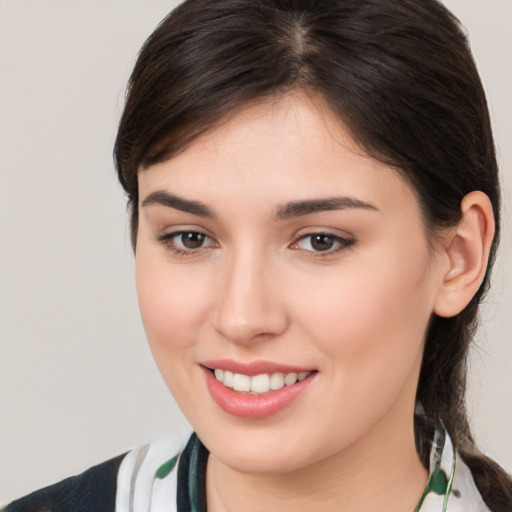 Joyful white young-adult female with medium  brown hair and brown eyes