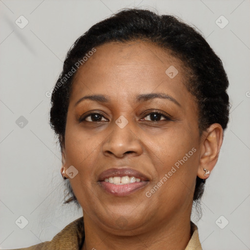 Joyful latino adult female with short  brown hair and brown eyes