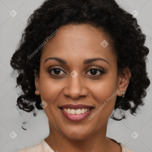 Joyful black young-adult female with medium  brown hair and brown eyes