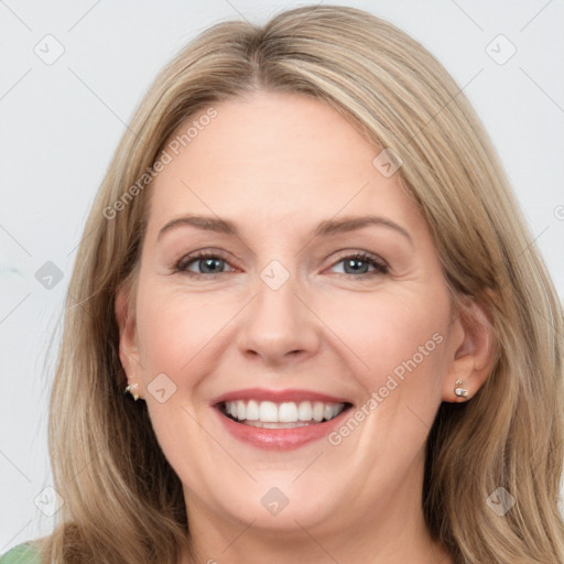 Joyful white young-adult female with long  brown hair and green eyes