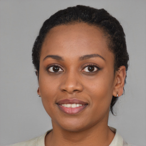 Joyful latino young-adult female with short  black hair and brown eyes