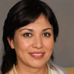 Joyful white adult female with medium  brown hair and brown eyes