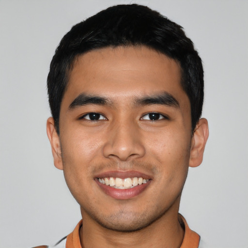 Joyful asian young-adult male with short  black hair and brown eyes