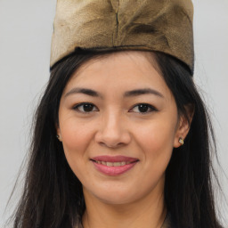 Joyful asian young-adult female with long  brown hair and brown eyes