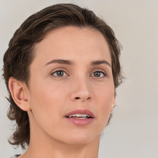 Joyful white young-adult female with medium  brown hair and brown eyes