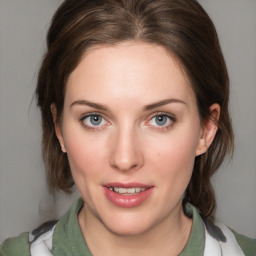 Joyful white young-adult female with medium  brown hair and blue eyes