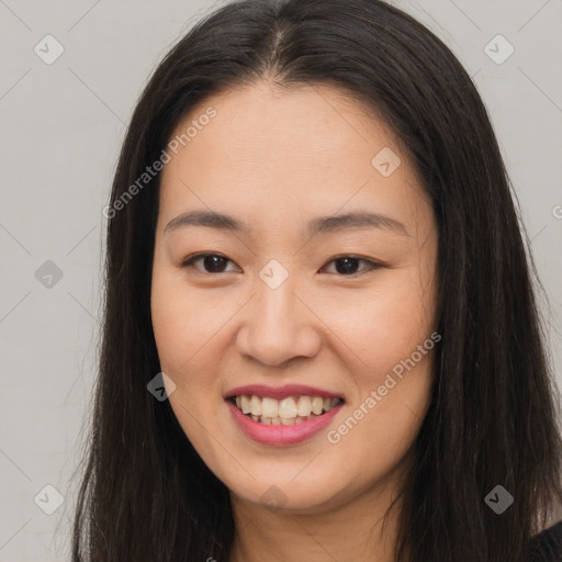 Joyful asian young-adult female with long  brown hair and brown eyes