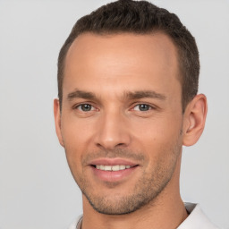 Joyful white young-adult male with short  brown hair and brown eyes