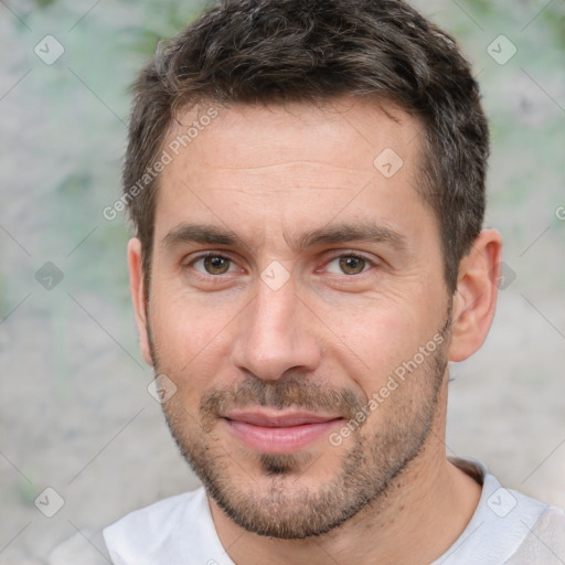 Joyful white adult male with short  brown hair and brown eyes