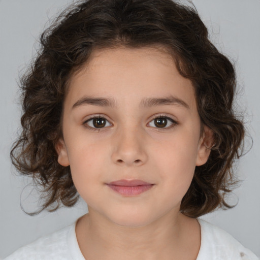 Joyful white child female with medium  brown hair and brown eyes