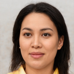 Joyful asian young-adult female with long  brown hair and brown eyes