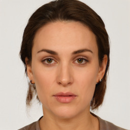 Neutral white young-adult female with medium  brown hair and brown eyes