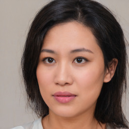 Neutral asian young-adult female with medium  brown hair and brown eyes