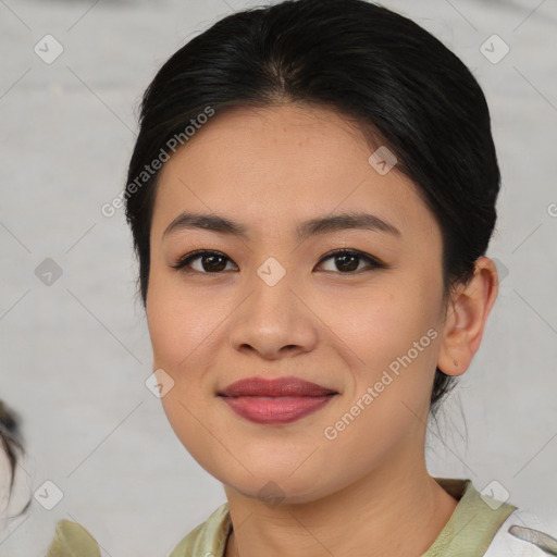 Joyful asian young-adult female with medium  brown hair and brown eyes