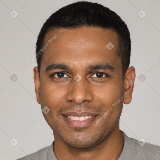 Joyful latino young-adult male with short  black hair and brown eyes