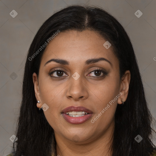 Joyful black young-adult female with long  brown hair and brown eyes