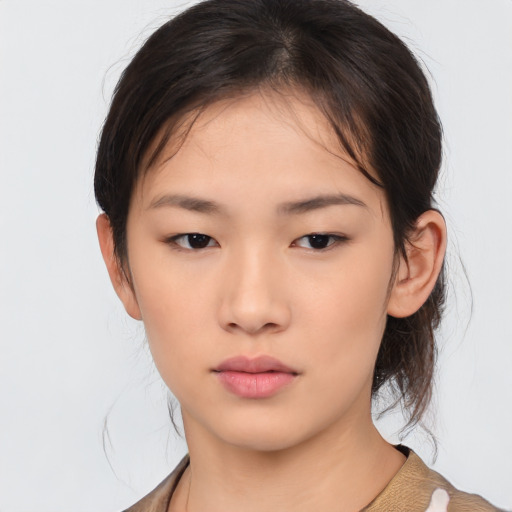 Neutral asian young-adult female with medium  brown hair and brown eyes