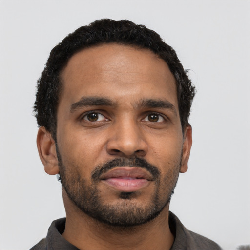 Neutral black young-adult male with short  black hair and brown eyes